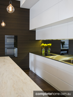 glossy white kitchen with invisible cupboards