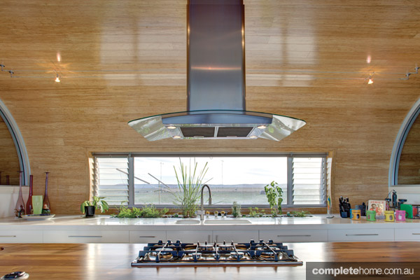 staron kitchen with stovetop and rangehood