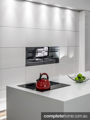 designer kitchens kitchen ideas with gloss white cabinetry, timber flooring and stainless steel accessories