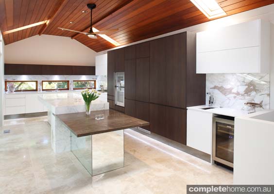 Embracing neutral and warm tones, this kitchen is practical, simplistic and inviting.