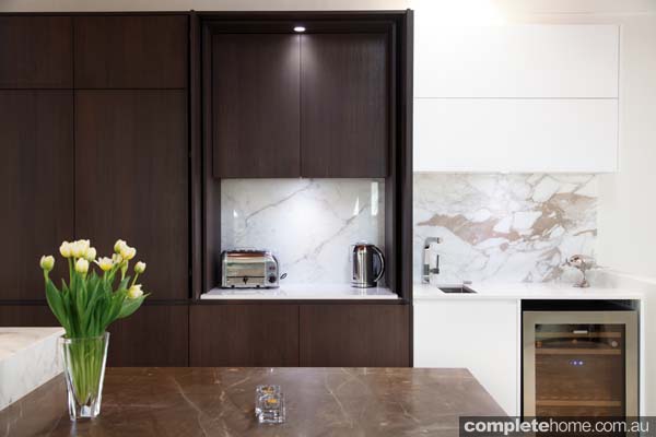 Embracing neutral and warm tones, this kitchen is practical, simplistic and inviting.