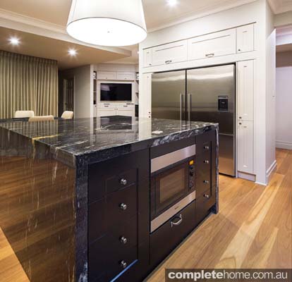 Take the splashback all the way up and across the wall behind the rangehood canopy to make the cooktop area an impressive focal point of the space. 