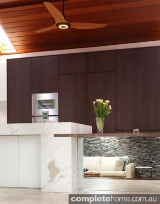 Embracing neutral and warm tones, this kitchen is practical, simplistic and inviting.