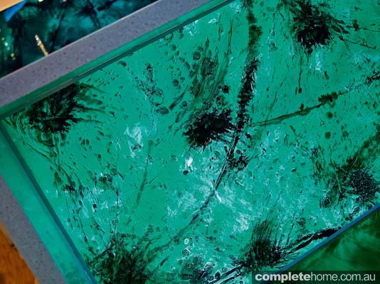 We love the acrylic couture malachite green splashbacks, which add 