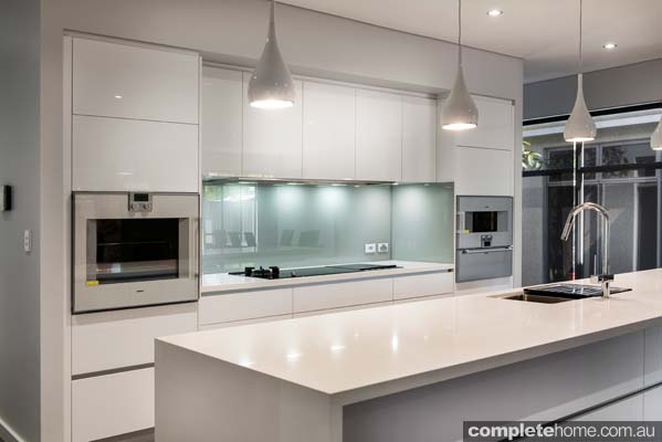 An understated white contemporary kitchen design from Western Cabinets.