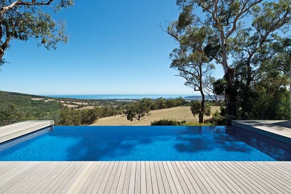 A modern pool design from Aquarius Pools with grey timber decking.