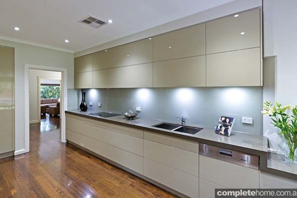 A sleek and streamlined designer kitchen from Kitchens by Peter Gill.