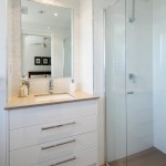 Gorgeous white bathroom with pearl tiles