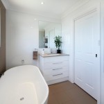 Gorgeous white bathroom with pearl tiles