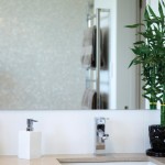 Gorgeous white bathroom with pearl tiles