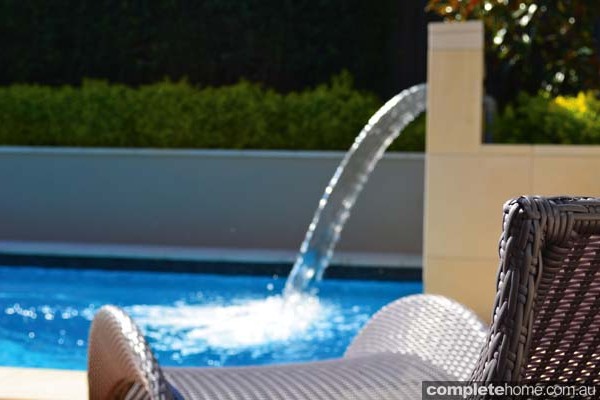 jakin pool with landscaping and water feature