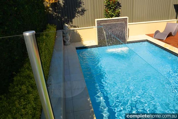 jakin pool with landscaping and water feature