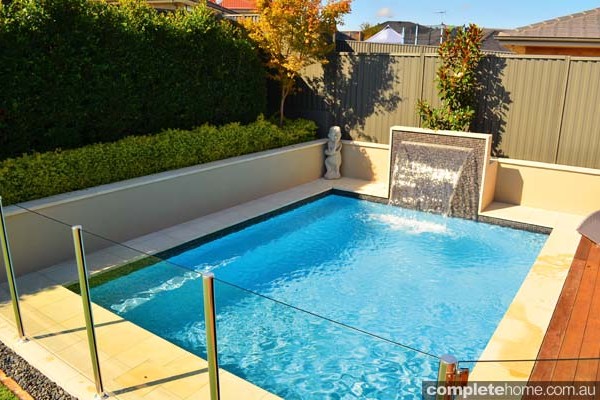 jakin pool with landscaping and water feature