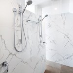 The gorgeous mosaic-tiled wall, which adds to the glamorous appeal of the bathroom.