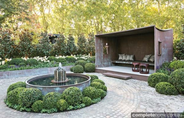 Garden with stone shafted pond
