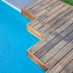Pool corner with wooden platform and lawn