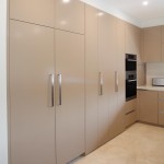 Functional kitchen with hidden laundry