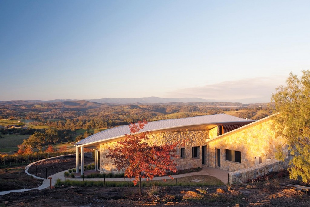 Curved, galvanised steel-plate rainwater heads were installed at each end of the house