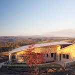 Curved, galvanised steel-plate rainwater heads were installed at each end of the house
