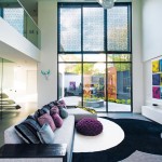 With its nod to mid-century architecture and a dash of industrial style, this modern family home by Canny Builders is a glass-fronted beauty.