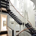 The staircase was salvaged and upcycled to create a striking chandelier