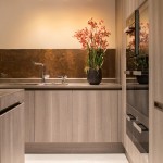Cylindrical pendants contrast nicely against the copper splashback