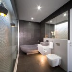 A grey stone bath and matching basin adds instant zen to the bathroom