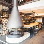 A unique fireplace turns up the heat in the living room and kitchen