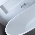 The dark, large-format tiles, with white gloss tiles for the side walls, creates a sense of grandeur