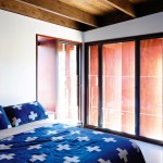 Small but functional, the bathroom and
bedroom (right) work in harmony