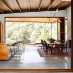 The open-plan kitchen lets in streams of light, meshing the indoors with the outdoors