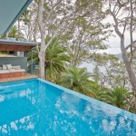 An infinity-edge pool is a modern addition to the backyard