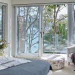 A neutral colour scheme with hints of blue complements the natural landscape outside
