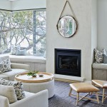 A palette of soft greys and browns adds warmth to the living area