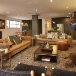 Expert tip: The striking contrast between the wallpaper and rug adds texture and drama to the space