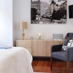 A block-colour armchair breaks up a neutral space