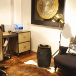 Busy art pieces add interest and liven up a simple room