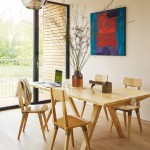 Large bi-fold doors open from the dining area on to the shaded balcony