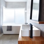 A mosaic tiled wall brings pattern into the space in a subtle way