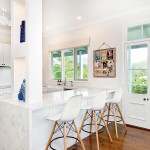 This open white kitchen lets the light in perfectly