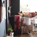A horse’s head and hanging bulb add to the quirkiness of the living room
