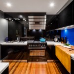 A kitchen with butcher’s block, deep fryer and chargrill plate