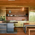 Copper walls and cabinetry play off against the
floor-to-ceiling timber
