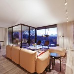 An oversized leather lounge is the perfect spot to watch the sun set over the city