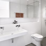 Opting for a white bathroom offers a calm reprieve from the strong colour scheme of
the residence