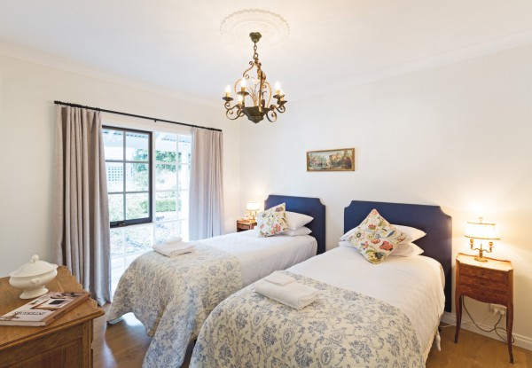 One of the five stylishly appointed bedrooms. Each can be configured to a king bed  or two single beds.