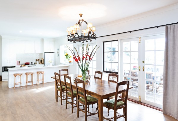 The handmade French farmhouse table is a beautiful addition to the light-filled kitchen.