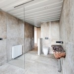 The petrified wood basin is a unique piece that adds instant character to the bathroom