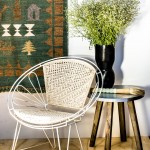 Cream Rope chair and Brisbane zinc side table. orsonandblake.com.au Large calligraphy brush in pale blue. stonepony.com.au Camel March hand-knotted sheep and camel wool rug/wall hanging dyed with indigo and pomegranate. hempgallery.com.au
