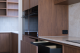 dark wood and black themed kitchen
